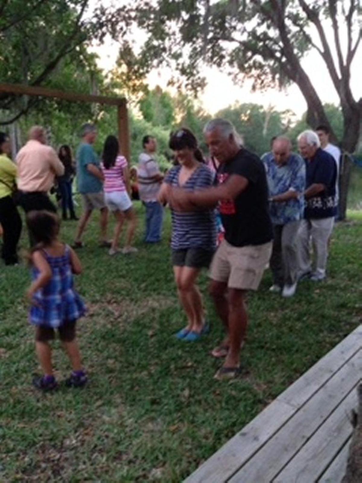 Baha’is and friends celebrate Naw Ruz (NewYear) by being taught a Lakota dance by Kevin Locke, a visiting Lakota and Baha’i, in 2015.