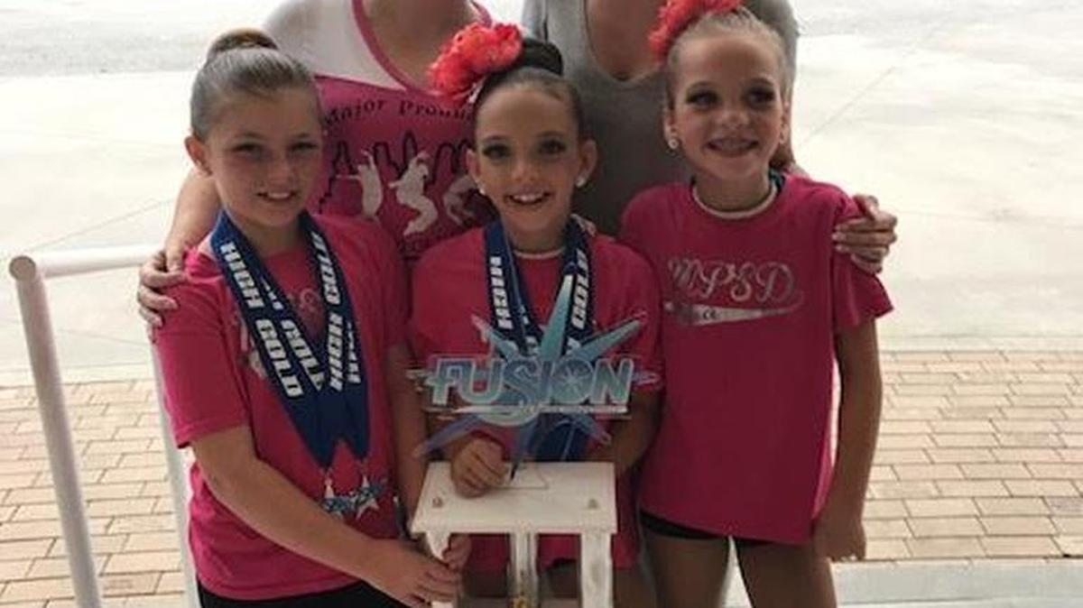Major Productions Studio of Dance, a dance studio in Ellenton, had their youngest team of dancers qualify to attend the Fusion National Dance Competition in Daytona, through regionals back in February. After a successful competition the girls were invited to compete once again for the national title. Although this young team of dancers didn’t win the entire competition, their second place wine was a huge accomplishment for these three girls who have danced less than one year together. Front row, from left, Abigail McNulty, Destiny Connolly, Hayden Schmidt; back row: Tracy Stratman (owner/director) and Sarah Johnson (choreographer/teacher). Information: www.mpstudioofdance.com, 941-586-6238.