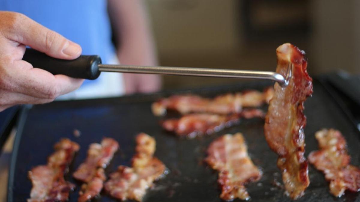 The pigtail food flipper from Cave Tools is designed to easily turn, flip, grab or move food on the grill without leaving marks or losing juices.