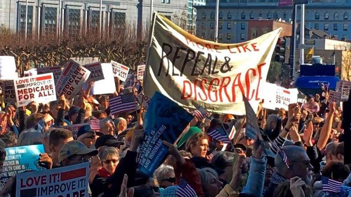 A large crowd gathers in San Francisco to rally against the dismantling of the Affordable Care Act. It was one of dozens of rallies staged across the country to denounce efforts to repeal President Barack Obama’s health care law.
