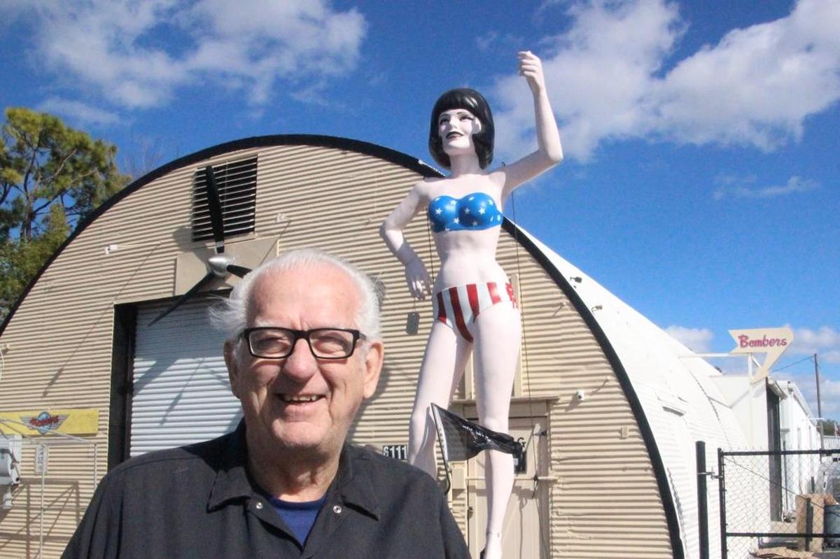 Tom Edmunds stands with Miss Uniroyal in front of Edmunds Metal Works at 6111 15th St. E. The company is marking its 40th year in the Bradenton area.