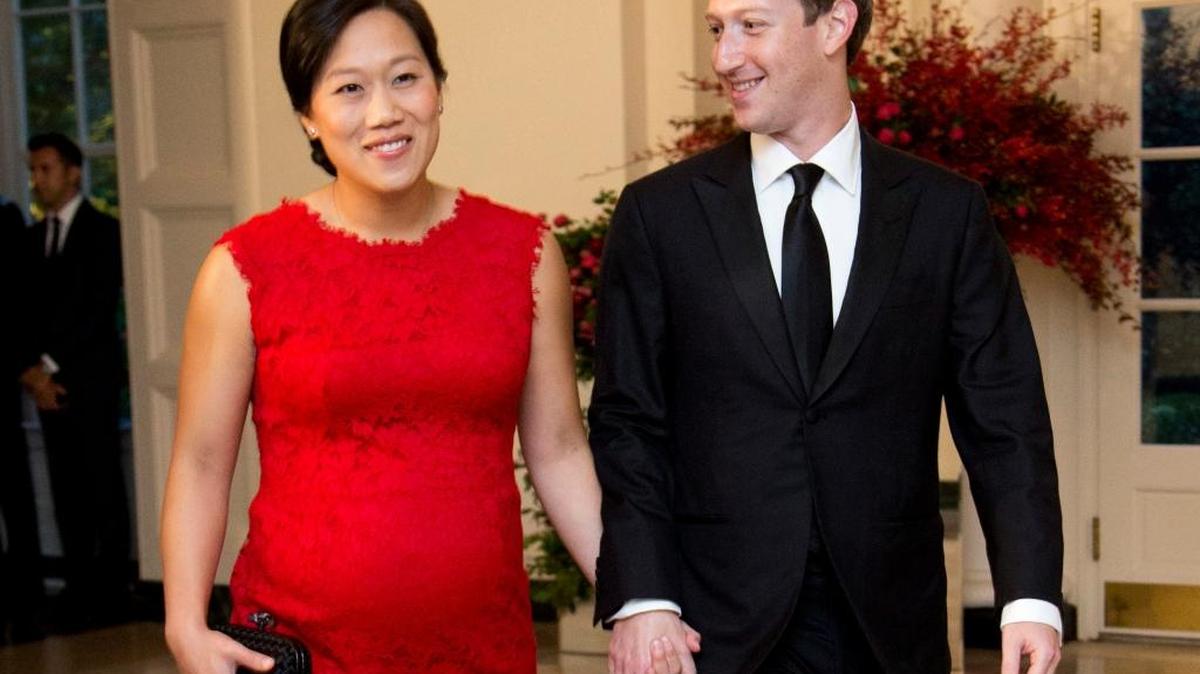 In this Sept. 25, 2015 photo, Facebook Chairman and CEO Mark Zuckerberg and his wife, Priscilla Chan, arrive for a State Dinner at the White House in Washington. Despite no national law, paid family leave benefits are rising in some business sectors. Highly visible executives, like Zuckerberg, have spoken out in favor of paid family leave laws.