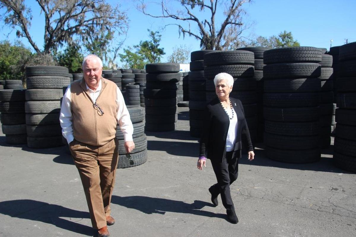 Dan and Betty Callaghan walk through a yard full of truck tires waiting to be retreaded at their Bradenton plant. The founded the company 40 years ago.