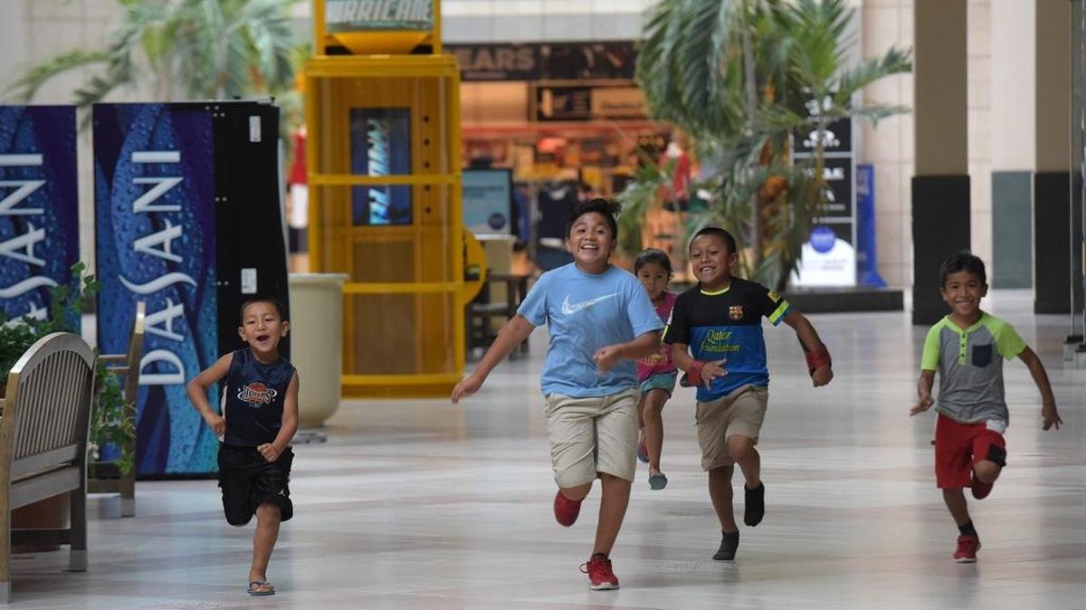 Children happily run in the Desoto Square Mall. The mall has a new manager, Don Burrow, who is determined to "bring the mall back to life."