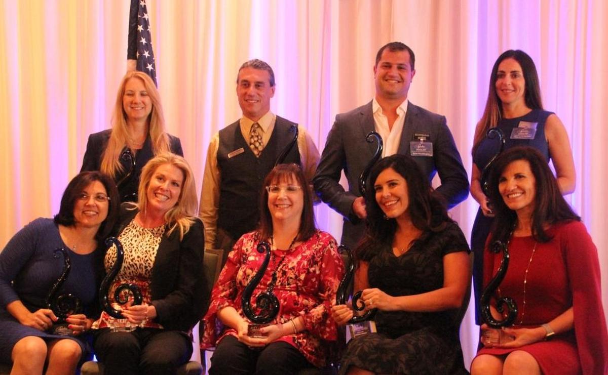 Sandies Award winners at the Lakewood Ranch Business Alliance luncheon were, front row from left, Lori Ruth, Bull by the Horns; Lisa Kirkland, Ray of Sunshine; Fern Grace, Best Rancher; Amanda Arnold, Rising Star; and Violeta Huseman, Volunteer of the Year. Back row, from left, Dianne Kopczyinski, One of a Kind; Adam Miller, Networking King; Keith Pandeloglou, Young Professional of the Year; and Charlotte Griffin, Networking Queen.