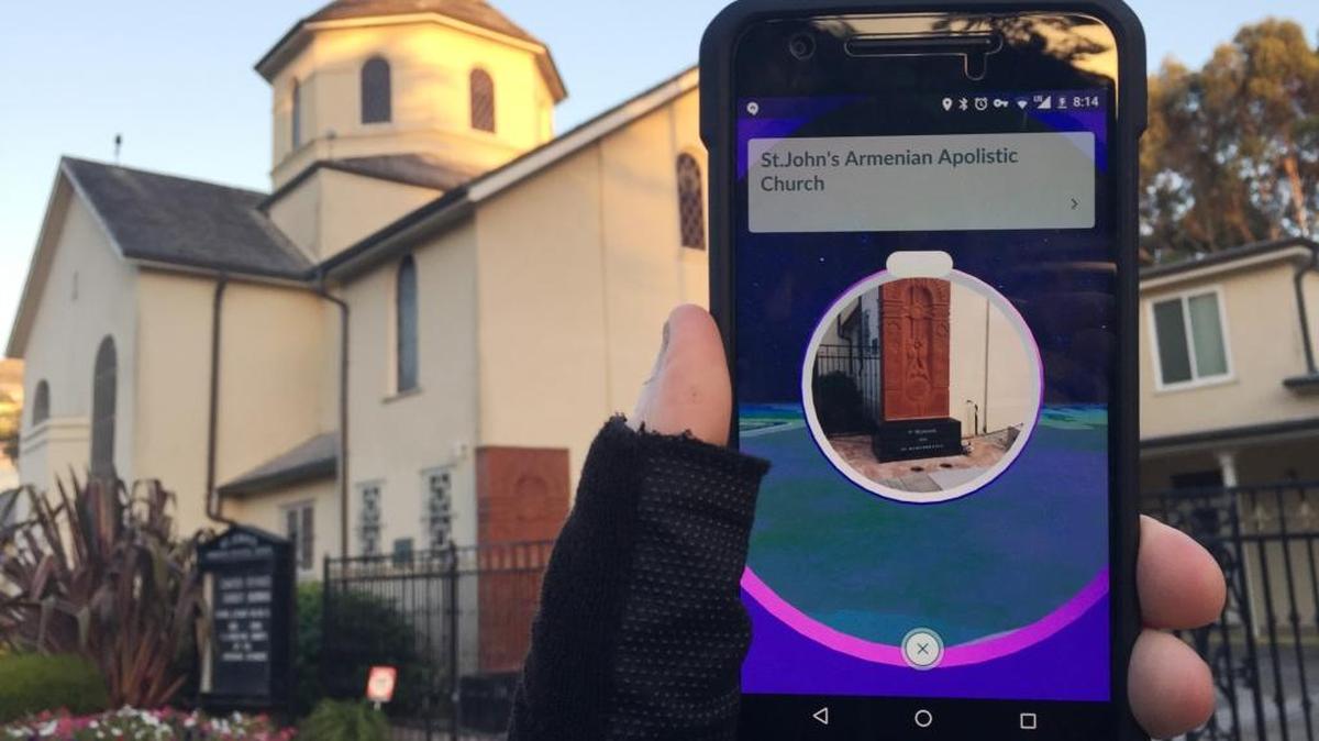 This Wednesday, July 13, 2016, photo, shows "Pokemon Go" on a smartphone in front of a church, in San Francisco. As players of the addictive smartphone game â€œPokemon Goâ€ traipse around real-world landmarks in pursuit of digital monsters, some ticked-off property owners are asking to have their positions in the game removed. The list includes the U.S. Holocaust Memorial Museum, Arlington National Cemetery and several ordinary churches and cemeteries.