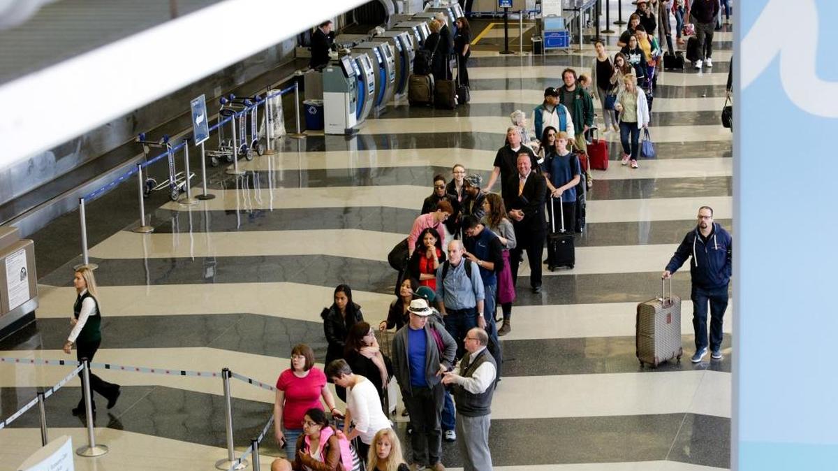 FILE - In this May 16, 2016 file photo, a long line of travelers waiting for the TSA security check point at O'Hare International airport in Chicago. The Transportation Security Administration has ousted its head of security operations and put new leadership in charge of screening operations at a major international airport, but long checkpoint lines and travel headaches already pervading the busy summer travel season are likely to continue.