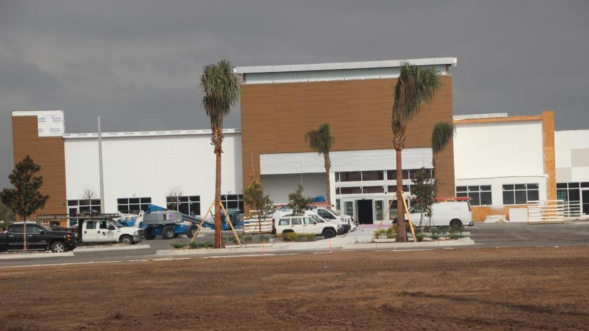 Construction workers swarmed over the Earth Fare supermarket site Friday. The company plans to hire more than 100 associates to operate the new store in Lakewood Ranch.