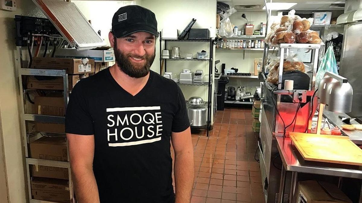 Andrew Kubes, co-owner of Smoqehouse, poses in his kitchen on Thursday, Aug. 17, 2017. He and his wife, Heidi, opened the restaurant on July 31. Every menu item at Smoqehouse is made from scratch.
