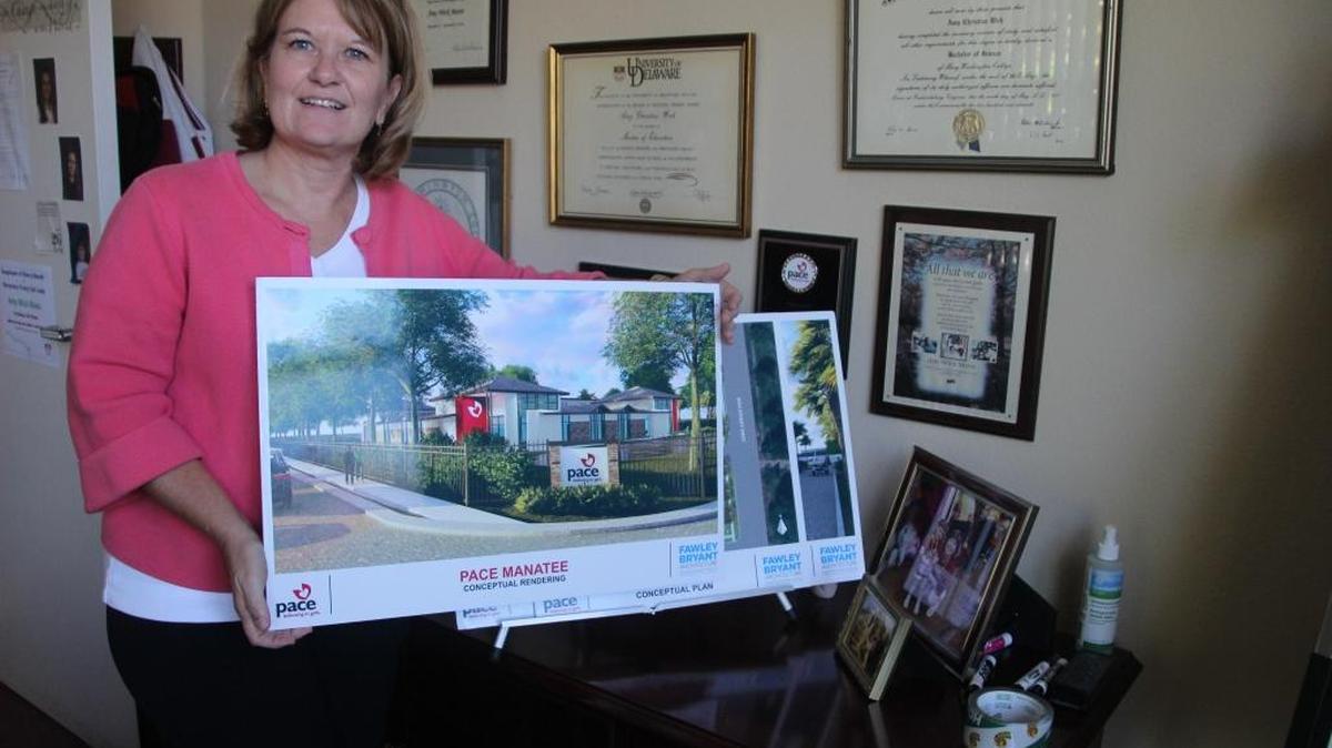 Amy Wick Mavis shows an artist’s rendering of what Pace Center for Girls will look like after its proposed expansion.