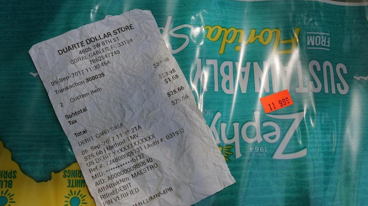 A receipt for two 24-packs of bottled water that were charged at $11.99 each at Duarte Dollar Store Tuesday.