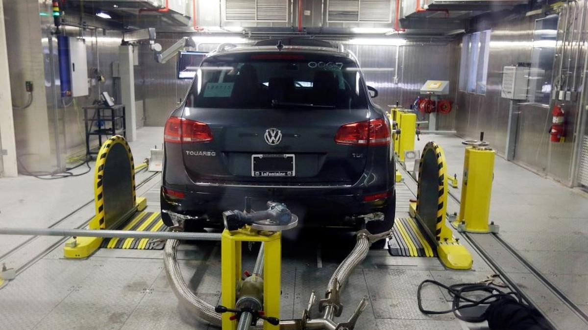 FILE - In this Oct. 13, 2015, file photo, a Volkswagen Touareg diesel is tested in the Environmental Protection Agency's cold temperature test facility in Ann Arbor, Mich. Volkswagen will spend more than $15 billion to settle consumer lawsuits and government allegations that it cheated on emissions tests in what lawyers are calling the largest auto-related class-action settlement in U.S. history. The settlement was revealed Tuesday, June 28, 2016, by a U.S. District Court in San Francisco.