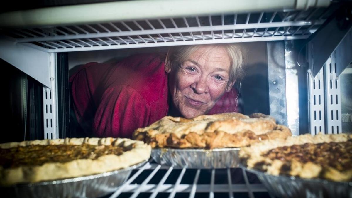 Andrea Spring, the new owner of Connie’s Produce, now called Mermaid Pies and Produce, poses for a portrait with freshly baked pies at the shop on Thursday afternoon.