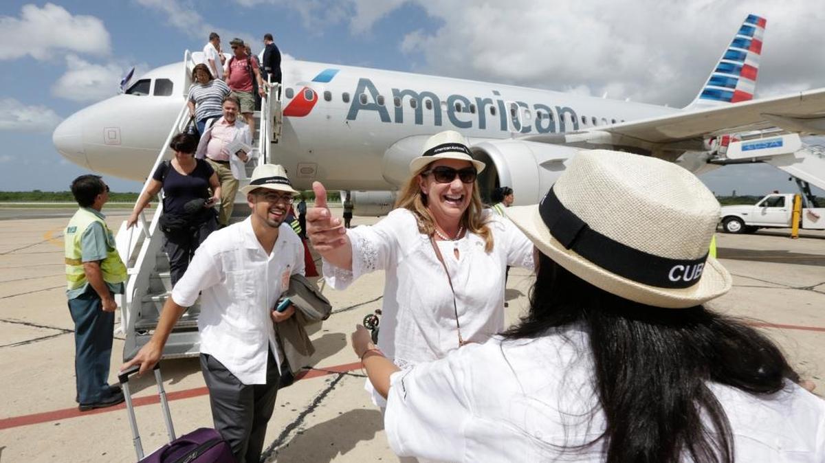 American Airlines executives Gabriel Crespo, left, and Lina Santiago, at right, greet Christine Valls, American Airlines Sales director for Florida, US Hispanic and the Carribbean. The trio arrived in Cienfuegos on American Airlines’ inaugural scheduled service from Miami to Cuba .