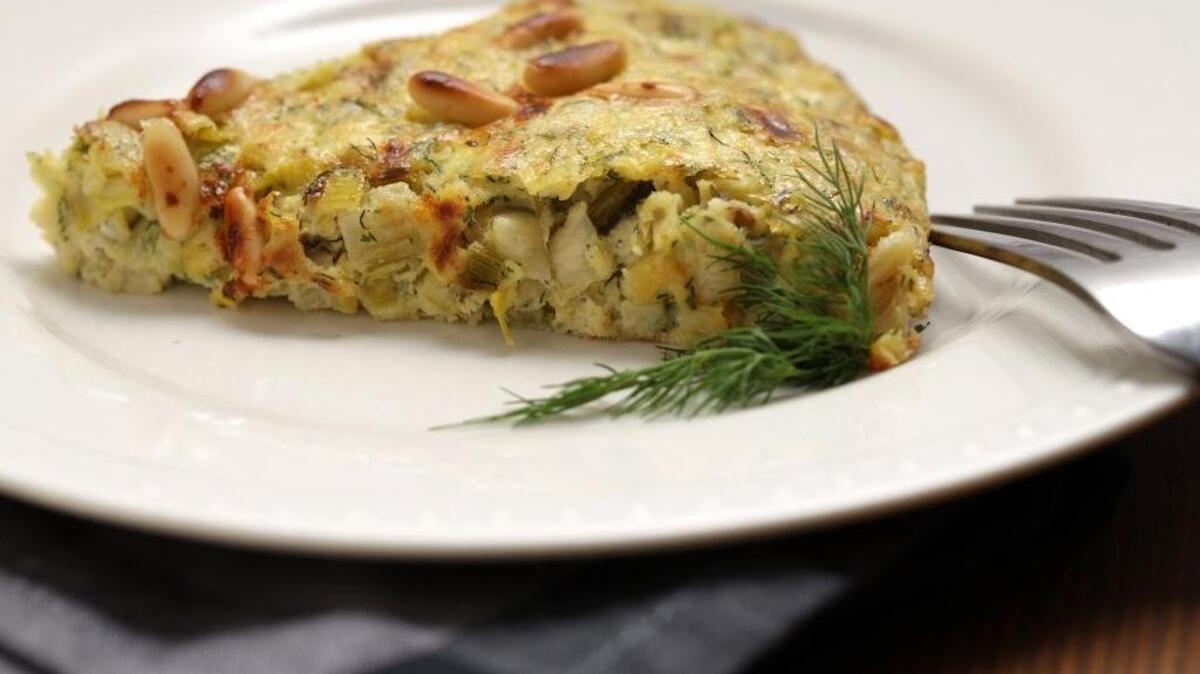 A frittata with leeks, feta and pine nuts is flavored with fresh dill and a bit of lemon zest.