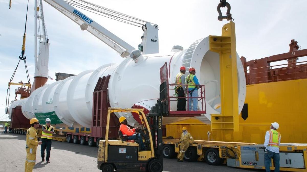 Workers prepare to secure oversized project cargo for loading at Port Manatee, which supports more than 24,000 jobs.