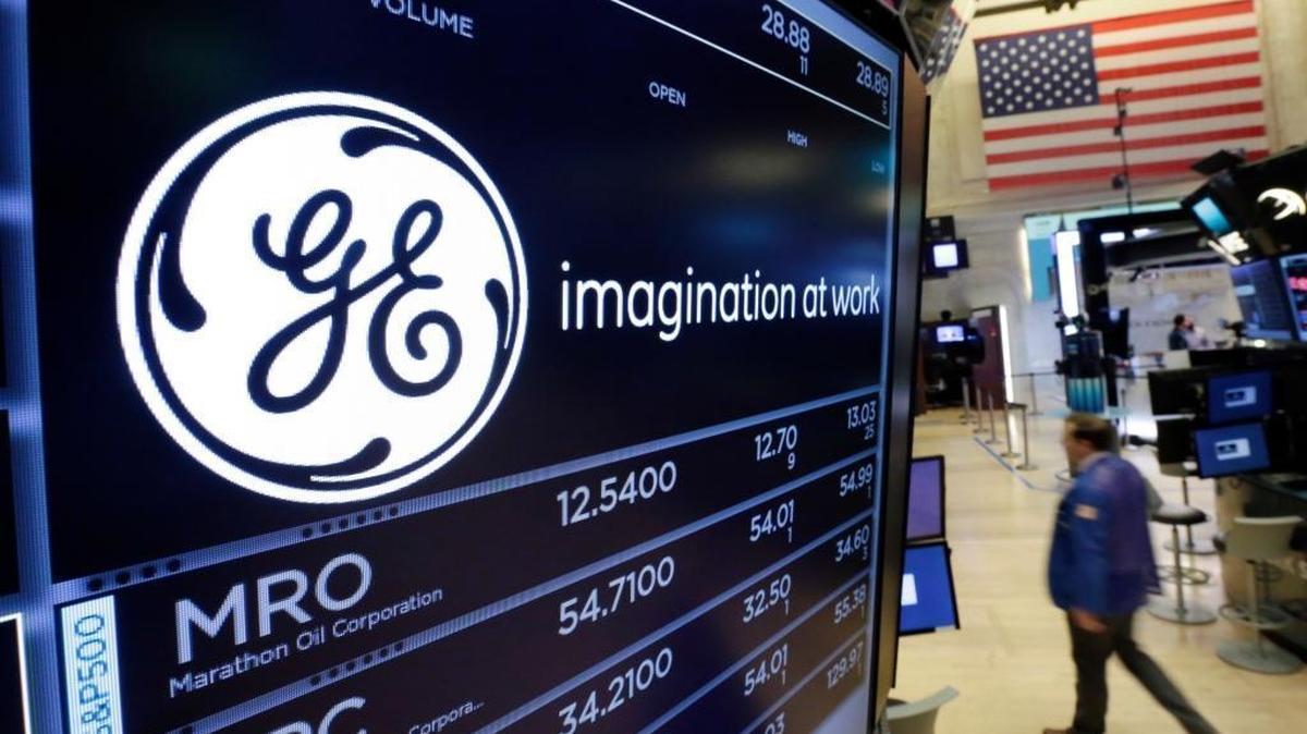 The General Electric logo appears above a trading post on the floor of the New York Stock Exchange on June 12. While the Dow Jones Industrial Average stock index is up 20 percent this year, GE shares have shed 40 percent.