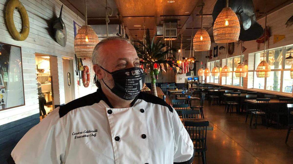 Chef Cesare Caldarelli is shown in the dining room of the Floridays Woodfire Grill & Bar, serving Compass By Margaritaville, a boutique hotel, at 12324 Manatee Ave. W., Bradenton.