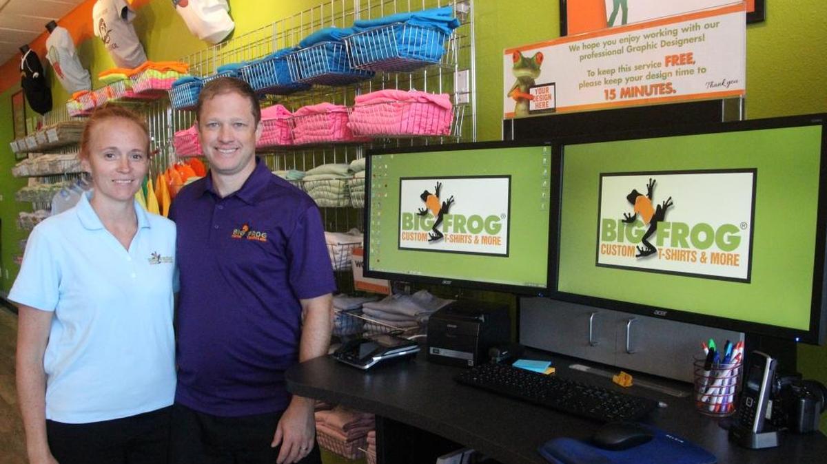 Matt and Mary Baehr will host a grand opening celebration of their Big Frog T-Shirts and More store on Saturday in Tara’s Twelve Oaks Plaza.
