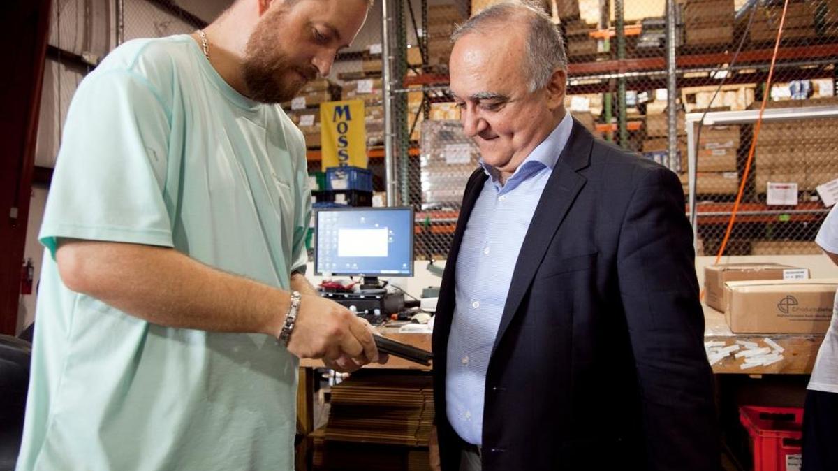 C Products Defense production manager Chad Panka looks over a finished rifle magazine with company CEO Adel Jamil. Magazines go through multiple quality checks before leaving the Manatee County factory.