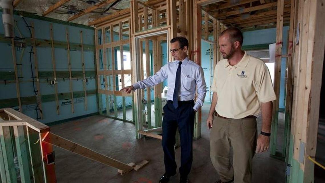 Developer Marshall Gobuty, left, tours a home under construction at the Mirabella at Village Green community in West Bradenton. Mirabella won a Silver Aurora Award for displaying environmental stewardship in energy-efficient home building for the second straight year.