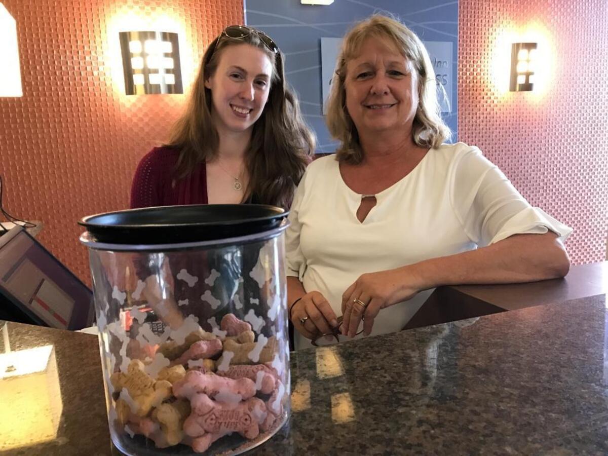 General manager Rebecca Stucko, left, and director of sales Kerri Alderson opened the Holiday Inn Express & Suites, 4450 47th St. W., to pets during Hurricane Irma. A jar of dog biscuits sits on the front counter.