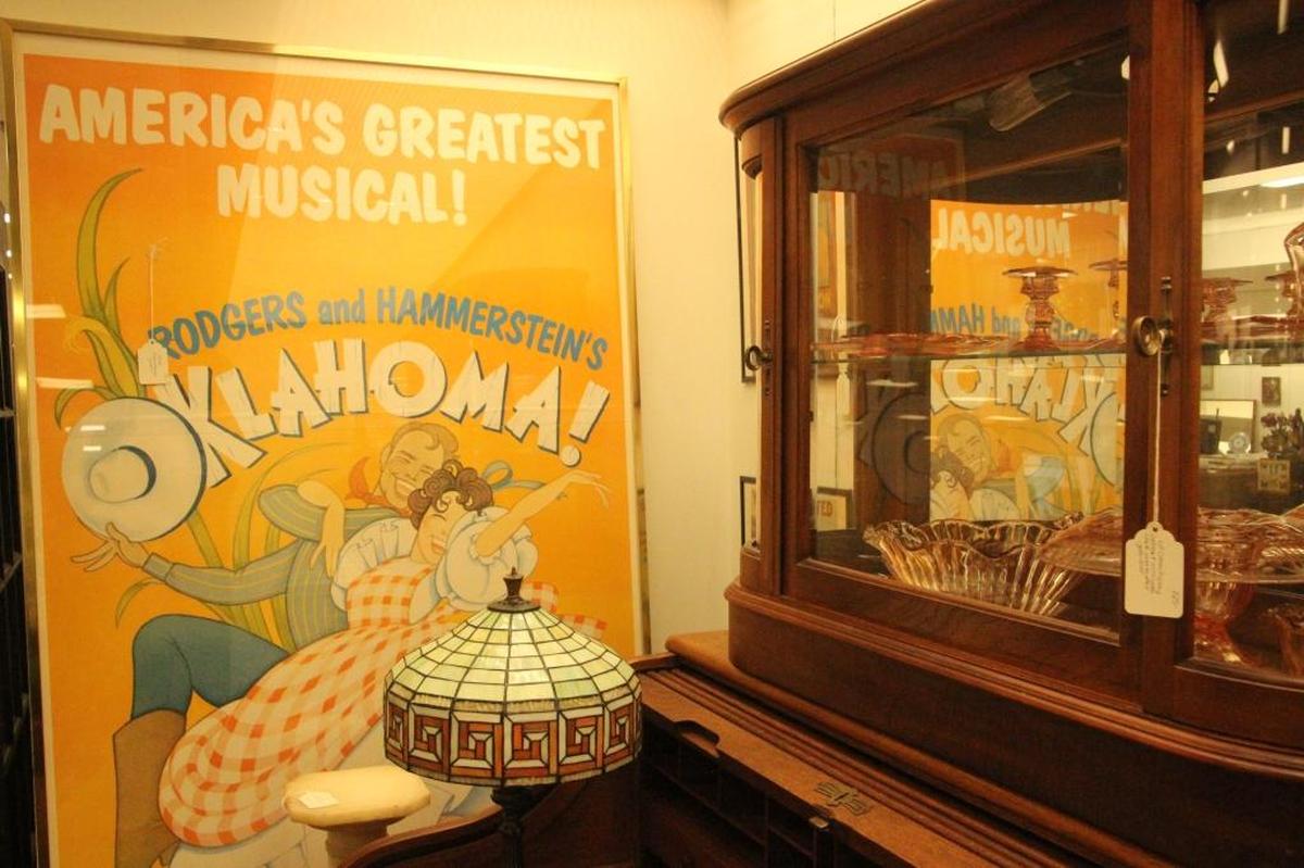 A poster from the musical Oklahoma brightens one of the walls at Your Treasure House in DeSoto Square mall.