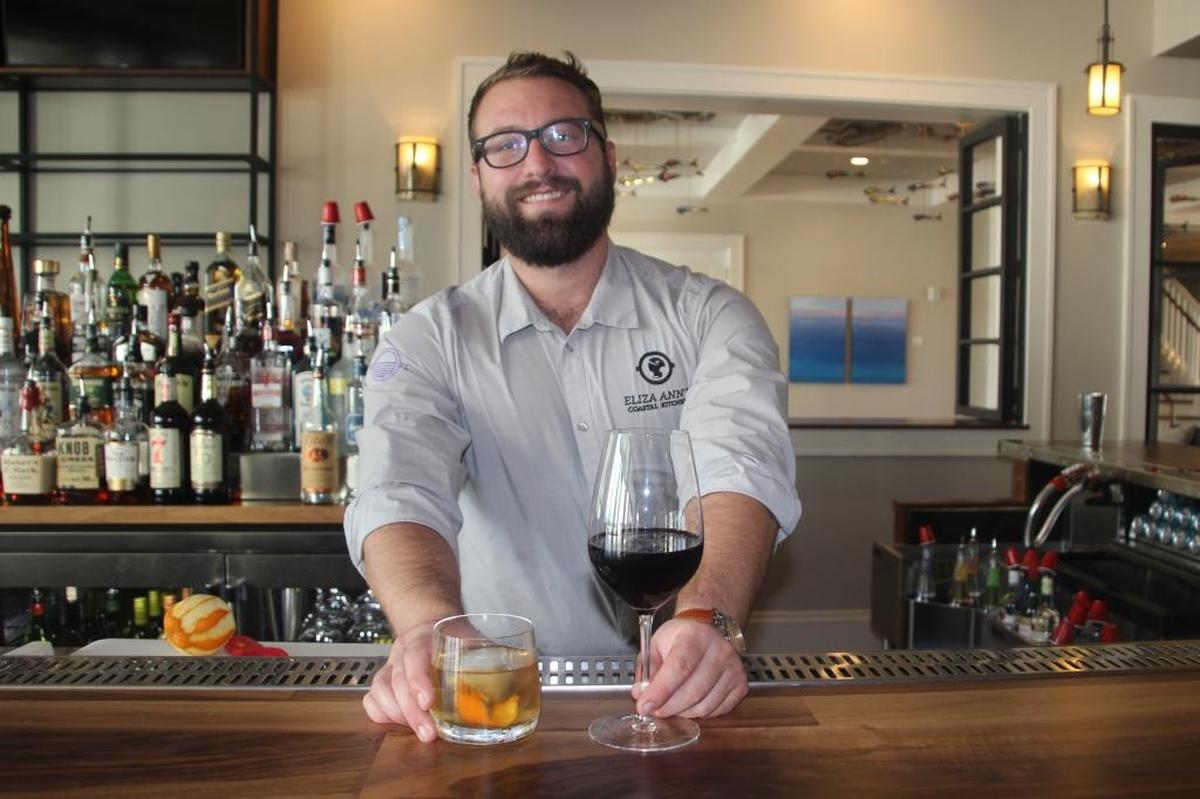 Douglas Fischer serves up a Plimsoll Sazerac and a Cabernet Sauvignon in Eliza Ann’s Coastal Kitchen at Waterline Marina Resort & Beach Club.