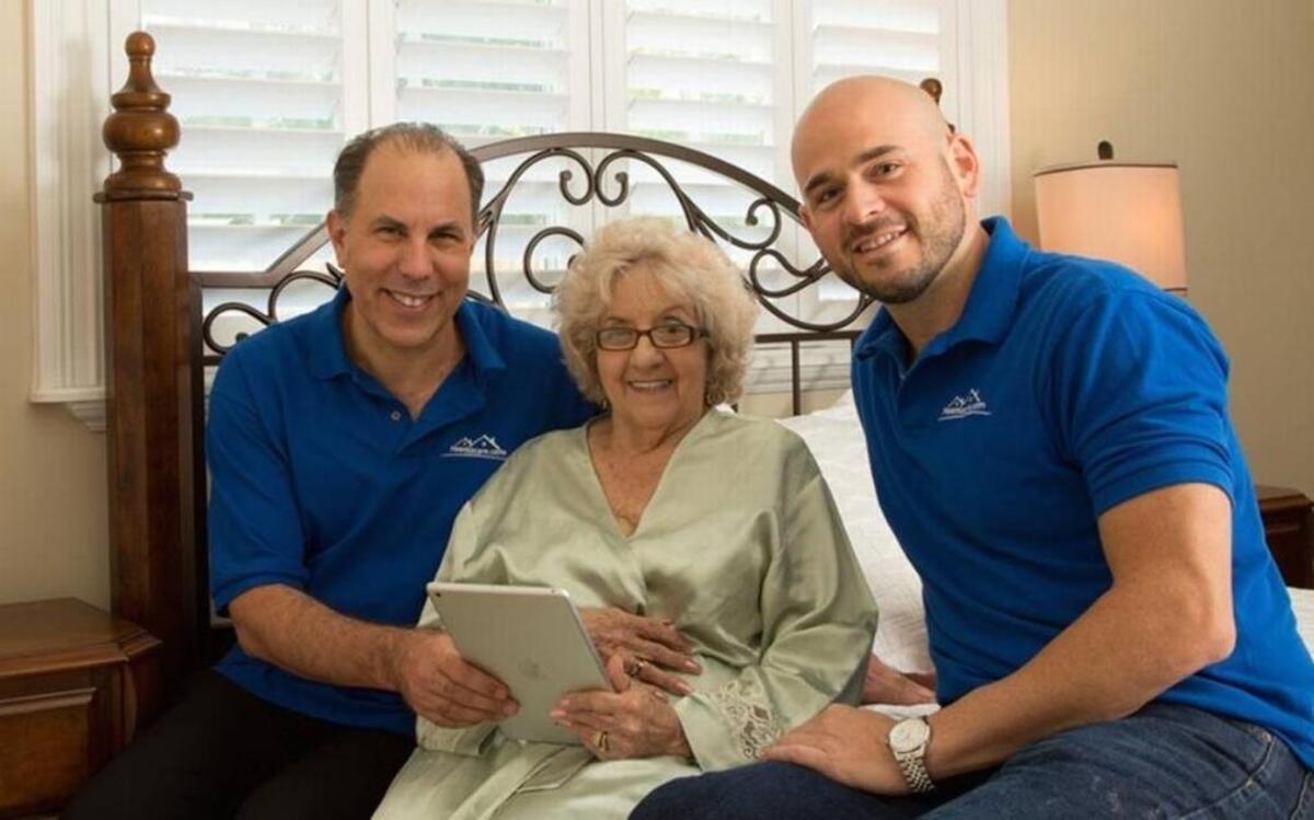 Room2Care founders Todd Florin, left, and Richard Ashenoff launched a senior home-care service that leverages the sharing economy. They are shown here with a customer, Edith Leake, in 2015. Courtesy of Room2Care