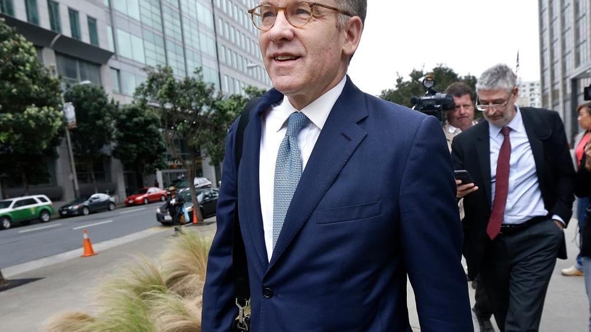 In this April 21 file photo, Robert Giuffra, an attorney for Volkswagen, leaves the Phillip Burton Federal Building after a court hearing in San Francisco. A $15 billion settlement over Volkswagen's diesel emissions cheating scandal cleared a big hurdle Tuesday with a federal judge granting it preliminary approval.