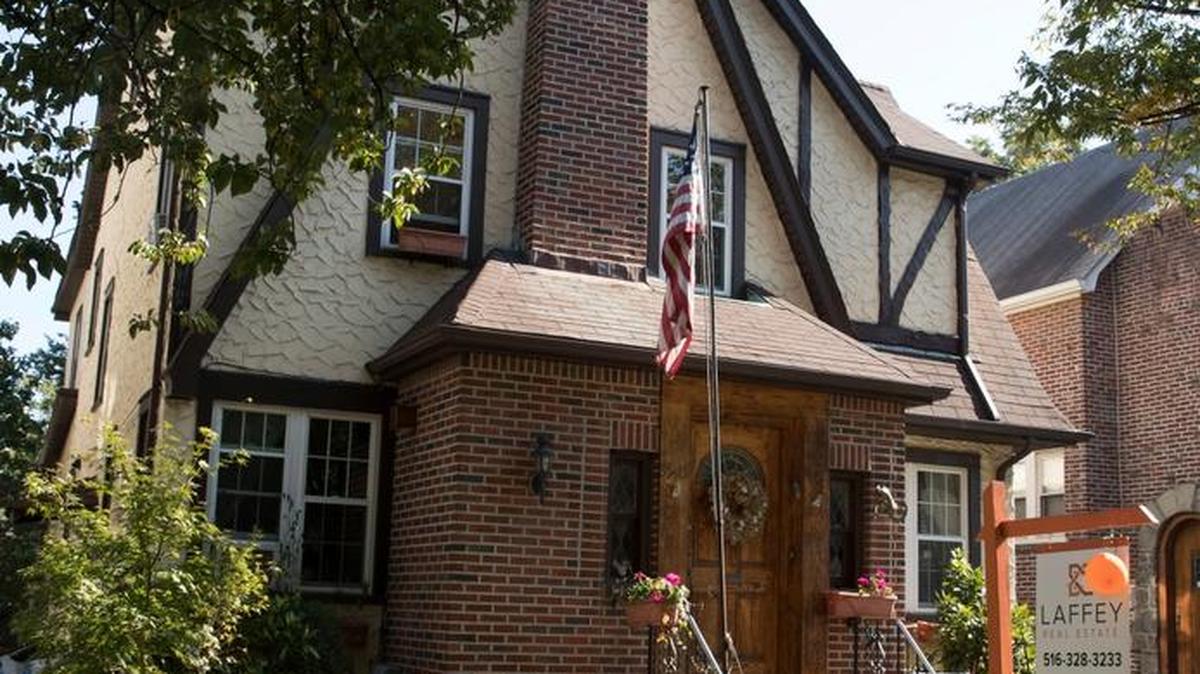 The exterior of a house in the Jamaica Estates neighborhood of the Queens borough of New York, where Republican presidential candidate Donald Trump spent his early childhood. Trump’s first boyhood home in New York City is going on the auction block Wednesday night with an opening bid of $849,000.