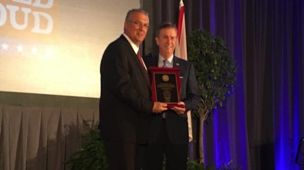 Jim Boyd receives the Legislator of the Year Award from Florida Farm Bureau president John Hoblick.