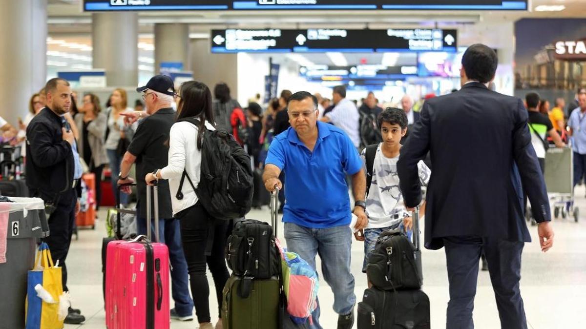 Travelers pack Miami International Airport as they hustle to leave ahead of Hurricane Irma.