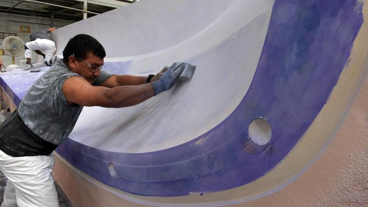 An employee works on a "plug", the object from which a mold is constructed, at Marine Concepts/Design Concepts. The company provides engineering and design services for composite tooling and manufacturing. The company, acquired in February by Leisure Product Holdings LLC, has worked with Manatee County Economic Development since expanding in Sarasota about two years ago to find employees and obtain state incentives.