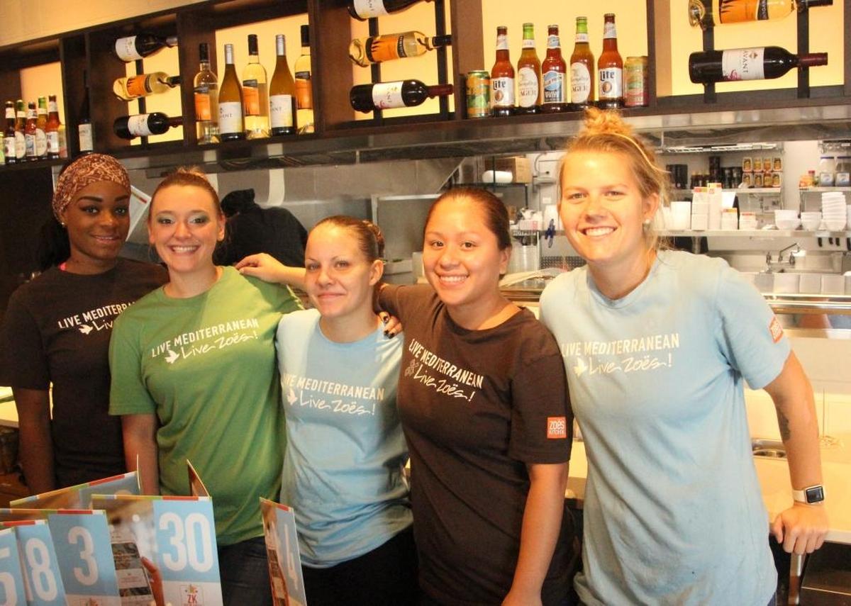 Staff members at the newly opened Zoes Kitchen in University Station include, from left, Zoe Brice, Nicole McBride, Sarah Hackett, Yessi Diaz and Hannah Bramm.