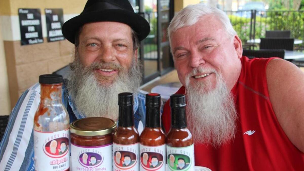 Jim Brannon, left, and Neil Currie of Bradenton are the creators of Saucy Guys hot sauce.