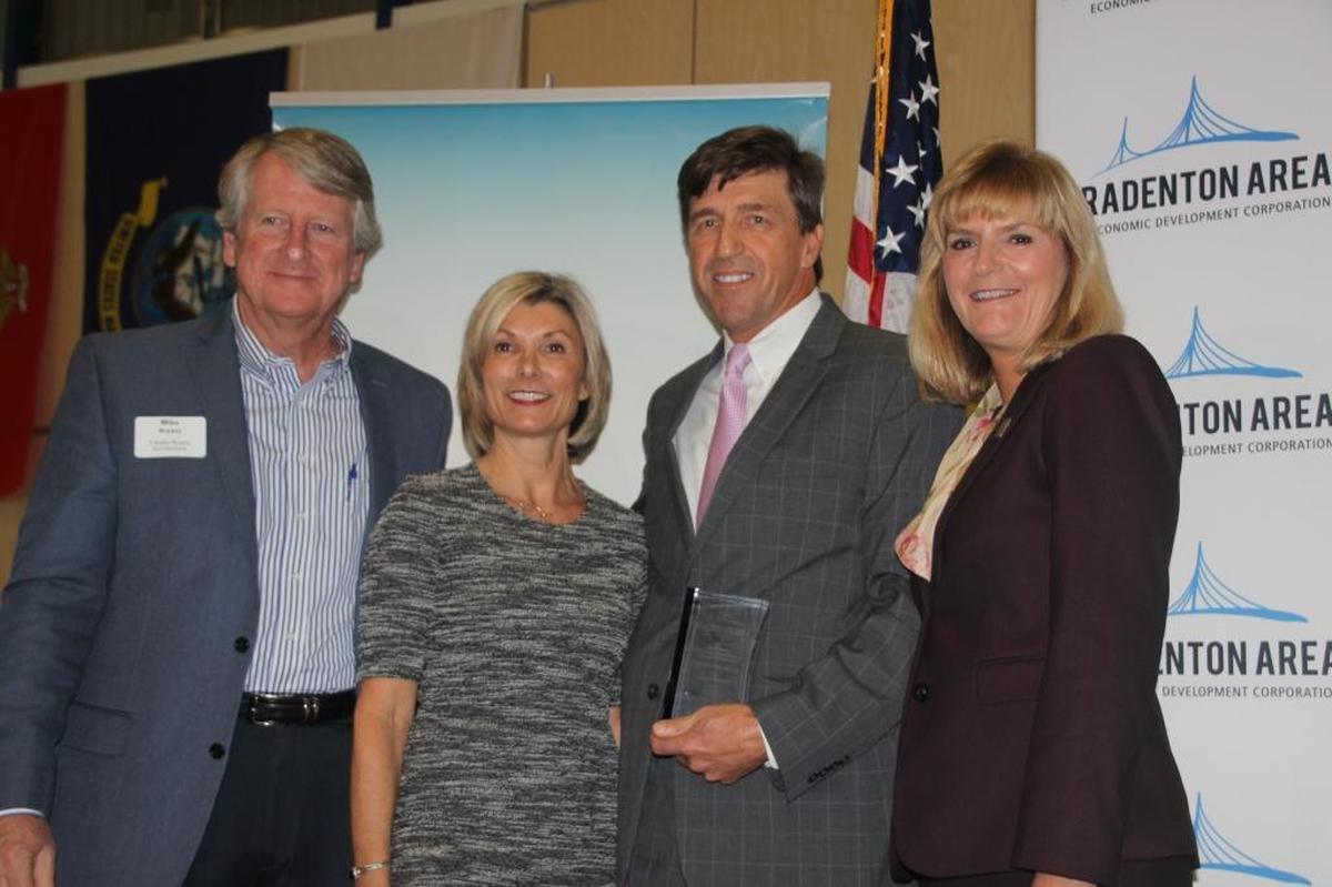 Kevin DiLallo, CEO of Manatee Healthcare System, second from right, received the Rick Fawley Economic Development Award of Distinction. Also shown are, from left, Mike Bryant, Sharon Hillstrom and Carol Probstfeld.