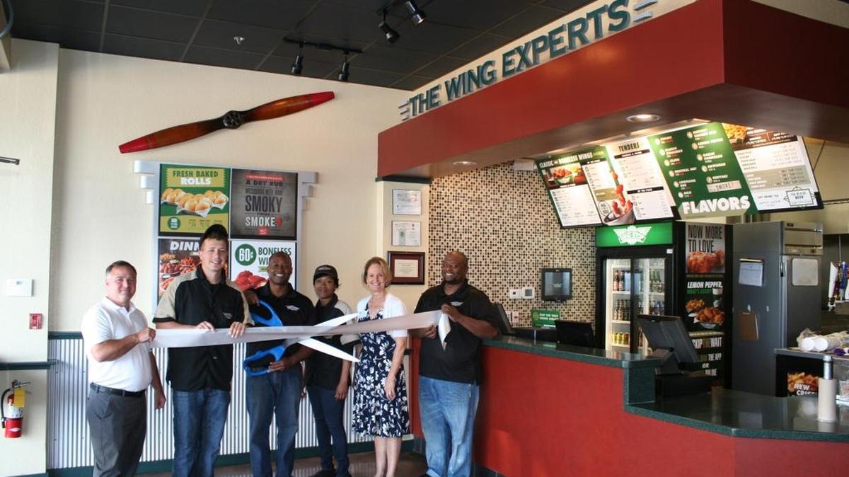 A ribbon cutting was held for WingStop, 3553 First St., Bradenton. The restaurant offers fresh flavored chicken wings, hand-cut seasoned fries and various sides for dining in or take-out. For more information, call 941-748-9464 or wingstop.com. Do you have a ribbon cutting you’d like to submit? Send it to Angie Monroe at amonroe@bradenton.com. Photo courtesy of Manatee Chamber of Commerce.