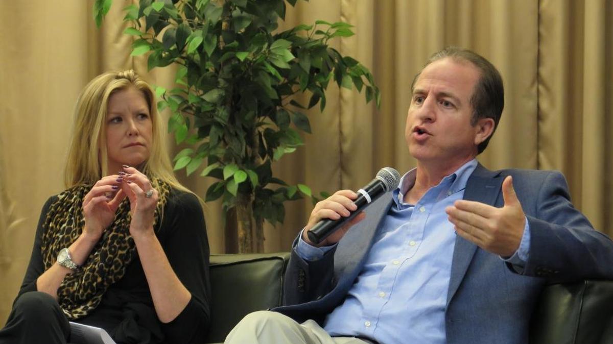 Kelly Defebo, director of sales at Visit Sarasota County, and Elliott Falcione, executive director of the Bradenton Area Convention and Visitors Bureau, speak at a panel discussion at the University of South Florida Sarasota-Manatee. The panel focused on impacts of Brexit on the tourism and real estate industries.