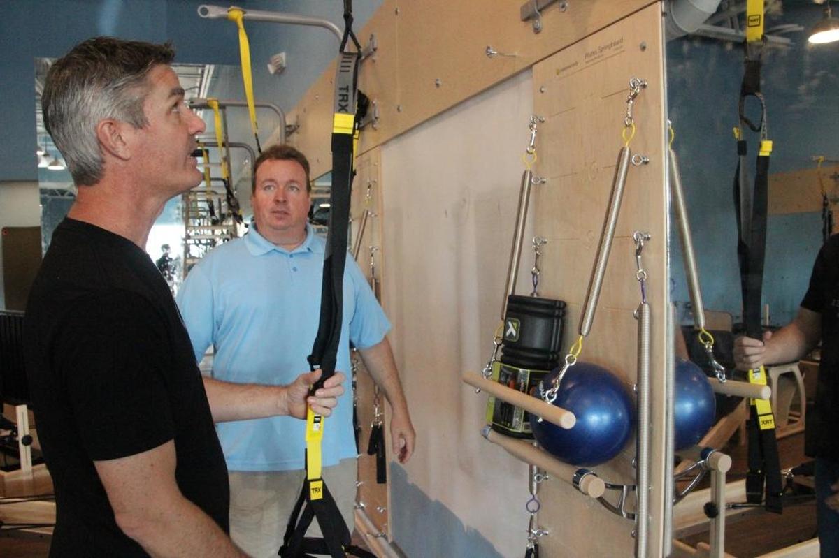 Peter Kilcullen, left, and Gary Keith discussed business ideas for three years before deciding to open a Club Pilates franchise.