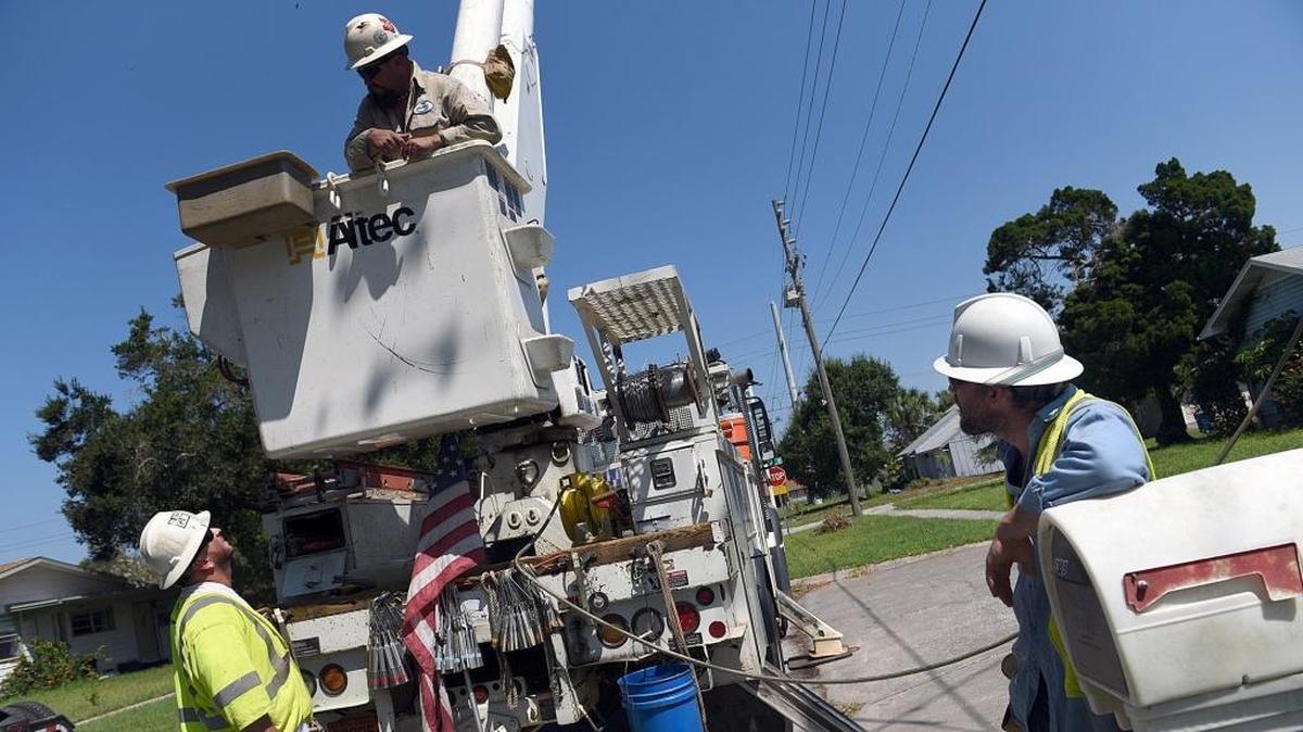 Contractors from North Carolina, at least seven trucks on one street, were worked to restore power to residents in West Bradenton in the aftermath of Hurricane Irma.