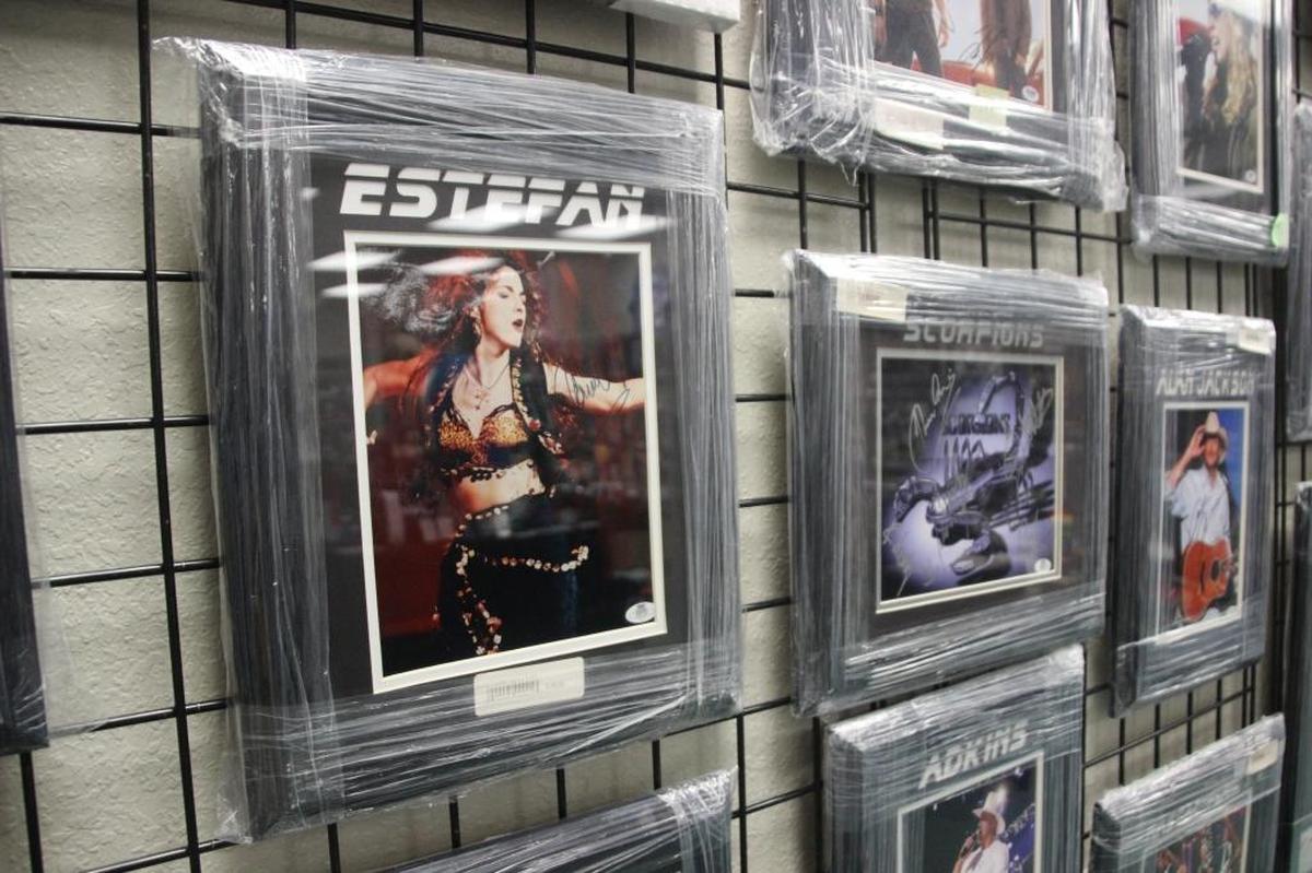 Gloria Estefan, the Scorpions and Alan Jackson share wall space at D’s Cards & Memorabilia.