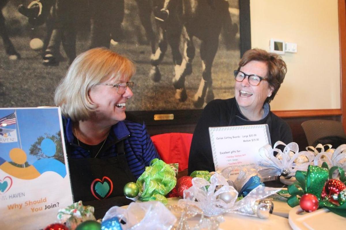 Sharon Hayes, left, and Kelly Askerud were enjoying The Market at Lakewood Ranch while staffing a holiday gift table for Friends of the Haven, which serves adults and children with disabilities. The farmers market is held 3-6 p.m. Wednesdays at the Sarasota Polo Club.