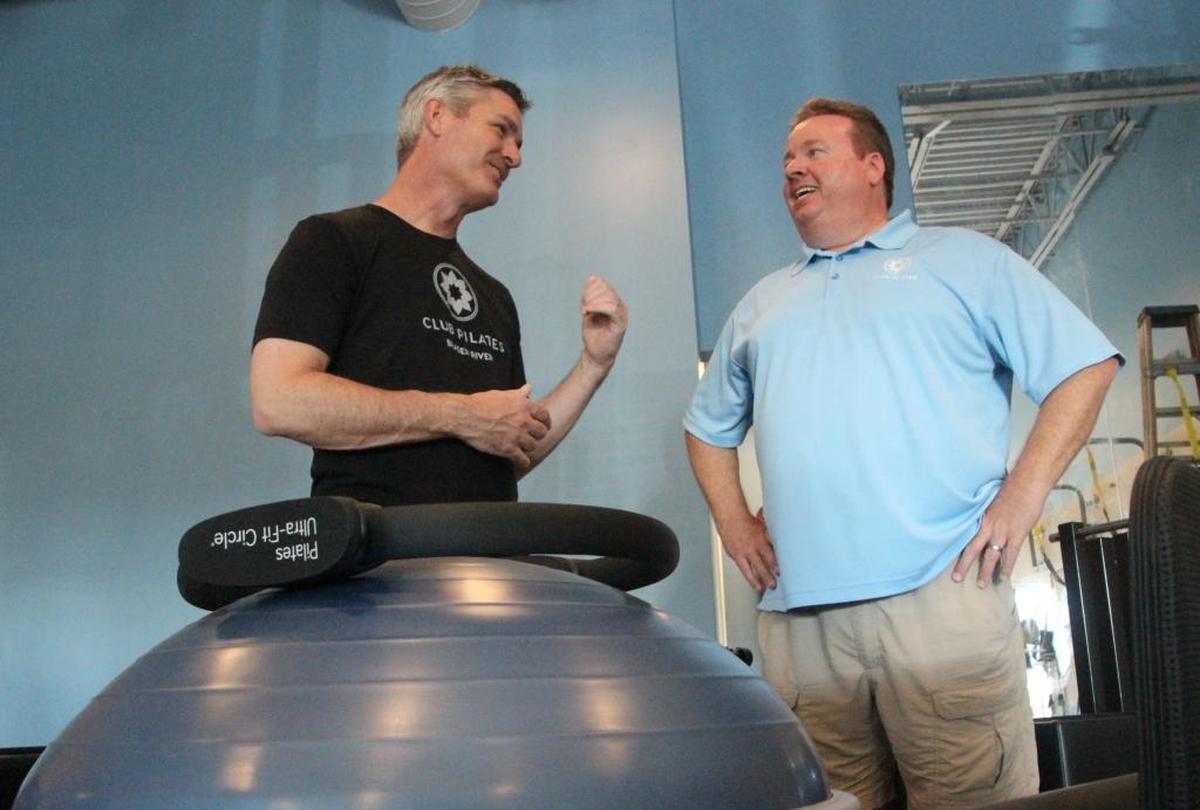 Peter Kilcullen, left, and Gary Keith are the owner of a Club Pilates franchise that will open Friday at 5408 Lockwood Ridge Road, Bradenton. They are standing near a Bosu balance trainer.