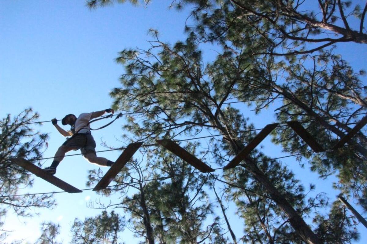 Steve Rolewski strides across one of the tree-top courses at TreeUmph! Adventure Park in East Manatee.