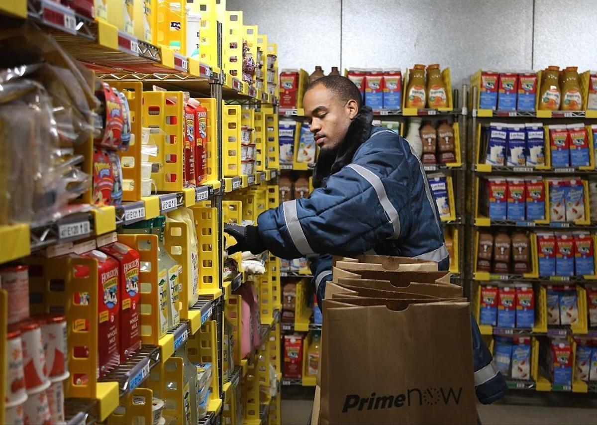 Amazon’s Prime Now Miami hub in Wynwood, where employee Michael Sterling checks products in the freezer before the hub opened in June 2017.