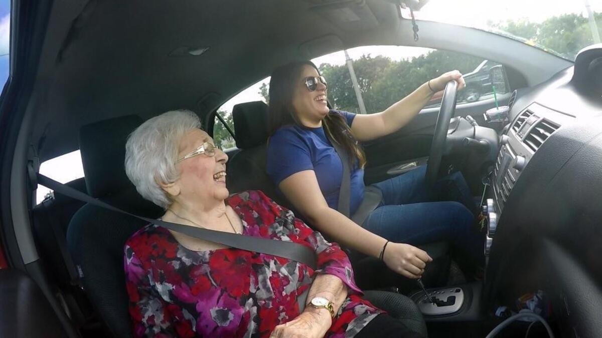 92-year-old Olga DeMartino shares a laugh with her Papa pal driver, Valeria Sosa, 26, as they return from DeMartino's hair appointment Tuesday afternoon, Nov. 14, 2017. Sosa is a Papa pal; she is employed by the startup that provides “grandkids on demand" — college students who are hired by the hour or the task to help elderly customers by taking them to appointments or to get groceries, or to do a little cleanup or cooking at home.