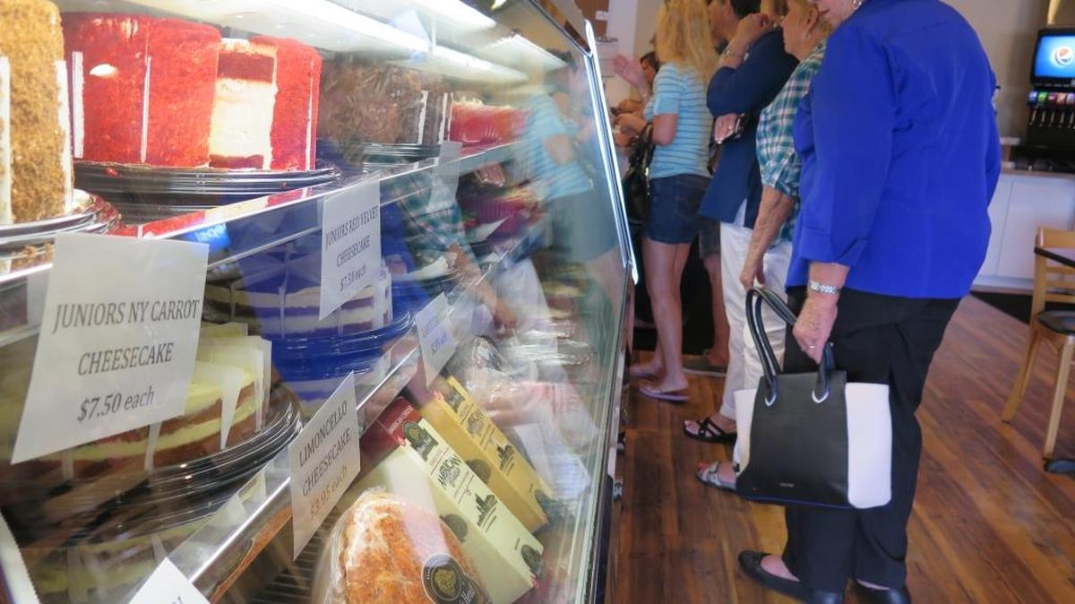 Customers peruse the deli case at Uncle Nick’s N.Y. Style Bagels, Subs & Deli, which is located at 5917 Manatee Ave. W.