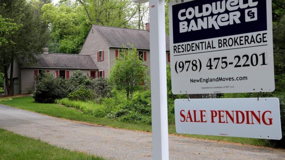 This Tuesday, May 24, 2016, photo shows a "Sale Pending" sign in front of a house in North Andover, Mass. On Thursday, May 26, 2016, the National Association of Realtors releases its April report on pending home sales, which are seen as a barometer of future purchases.