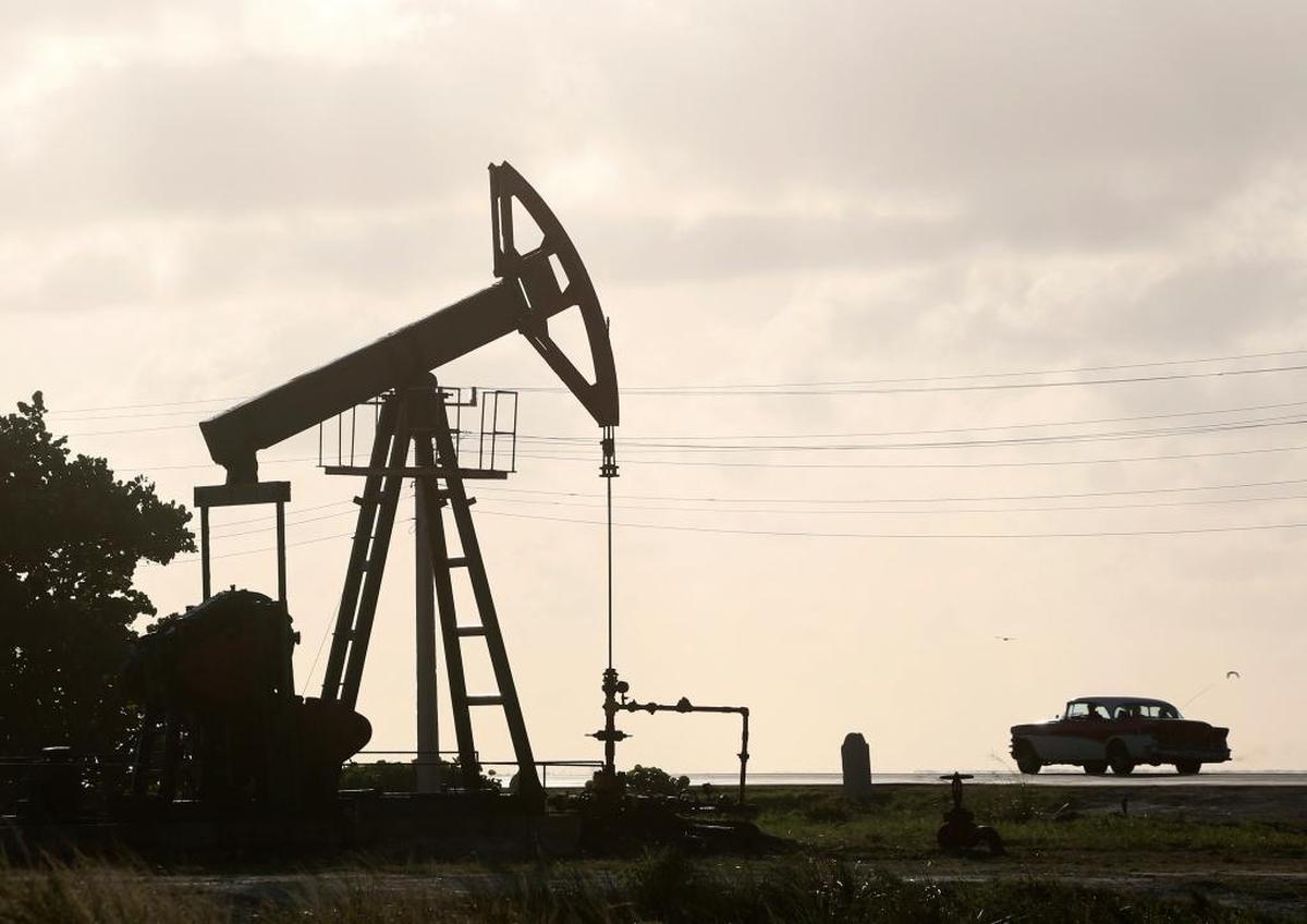 An oil well operates in Boca de Jaruco, Cuba. Officials are warning of tough times with authorities ordering energy-saving measures and some state entities reducing hours of operation.